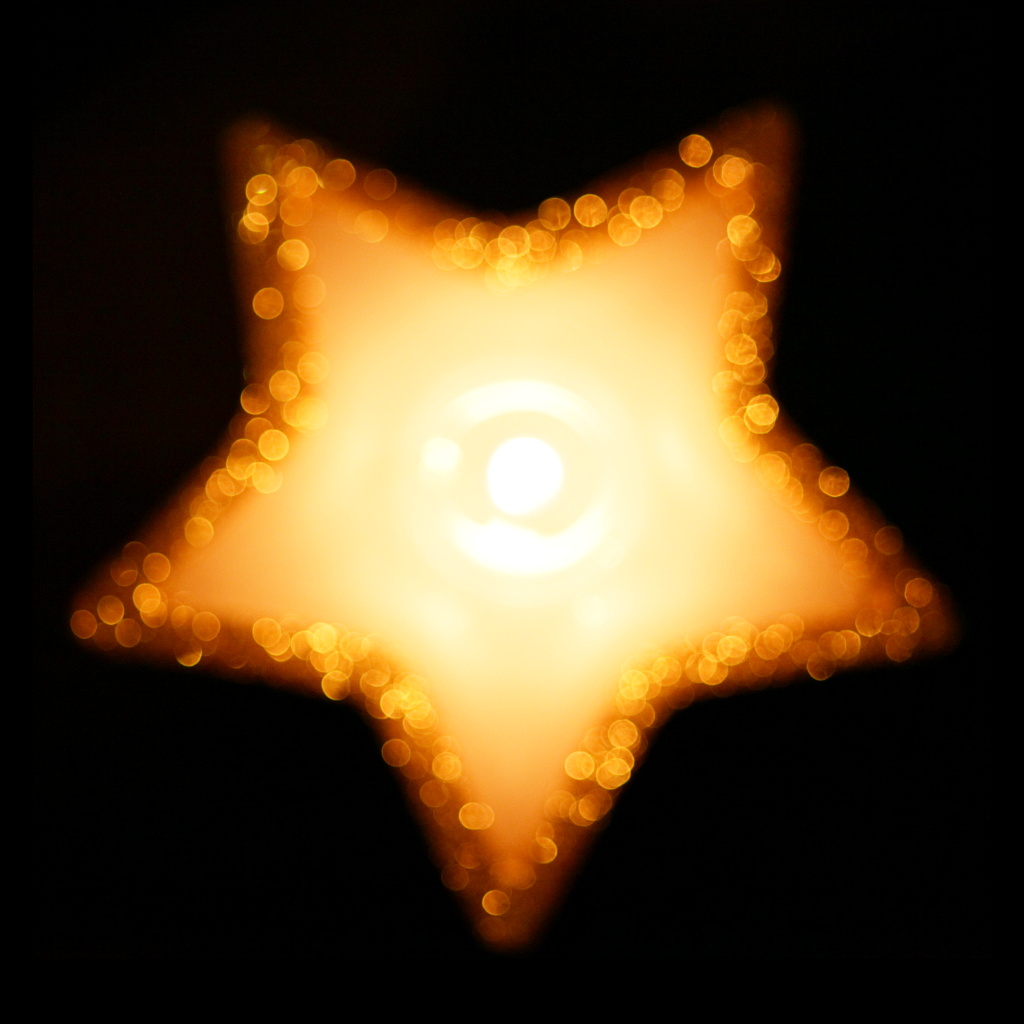 Candlelight bokeh on a dark winter evening
